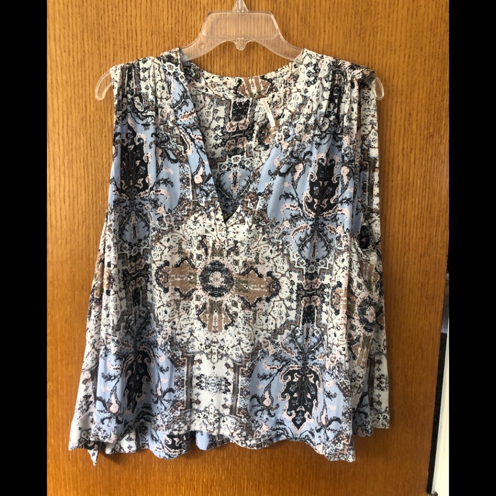 Free people sleeveless blouse.